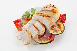 Cooked and sliced chicken with courgettes photo