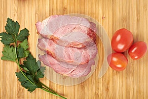 Cooked sliced pork barbecue steak on wooden cutting board on the white background