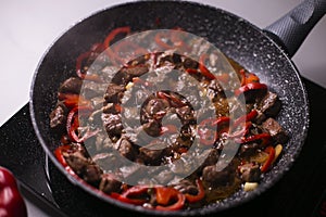 Cooked soba with meat in a pan