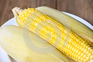 Cooked sweet corn background, ripe corn cobs steamed or boiled sweetcorn for food vegan dinner or snack