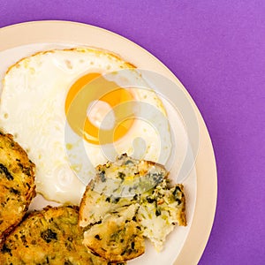 Cooked Vegetarian Bubble And Squeak Cakes With A Fried Egg