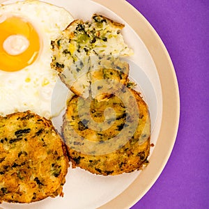 Cooked Vegetarian Bubble And Squeak Cakes With A Fried Egg