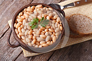 Cooked white kidney beans in a bowl closeup horizontal top view