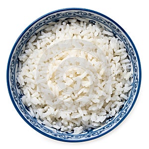 Cooked white rice in an asian white and blue ceramic bowl isolated on white from above