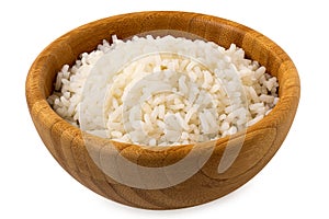 Cooked white rice in a dark wood bowl isolated on white