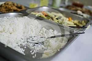 Cooked white rice with party foods