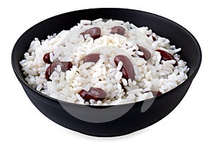 Cooked white rice with red kidney beans in a black ceramic bowl isolated on white