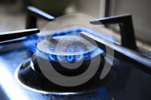 Cooker as heater. Blue flame from gas hob produce greenhouse gas emissions. Wastage of natural resources. Kitchen stove