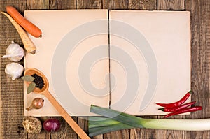 Cookery book on wooden background photo