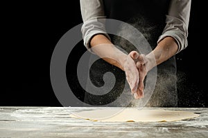 Cookery.Chef prepares dough for pasta, pizza, bread.Preparation and work with flour. Delicious food, recipes, cooking, gastronomy