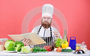 Cookery on my mind. Cooking skill. Book recipes. According to recipe. Man bearded chef cooking food. Check if you have