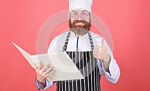 Cookery on my mind. Improve cooking skill. Book recipes. According to recipe. Man bearded chef cooking food. Culinary