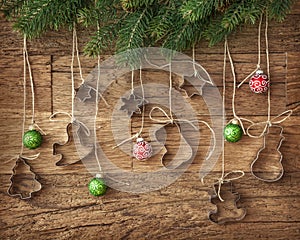 Cookie cutter and christmas baubles photo