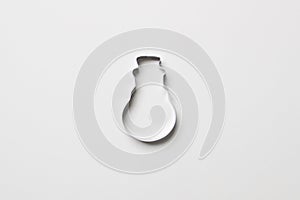 Cookie cutter in form of snowman on white colored paper background. isolated. close up. mock up