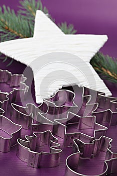 Cookie cutters on Christmas background