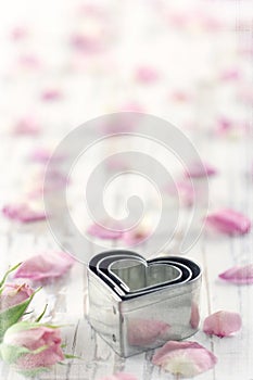 Cookie cutters on a white old vintage wooden background