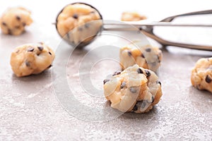 Cookie dough with chocolate chips and scoop