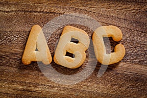 Cookie letters on wooden background