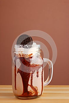 Cookie milkshake with chocolate on wooden table with copy space. oreo dessert milkshake