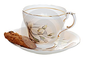 Cookie with old tea cup and saucer