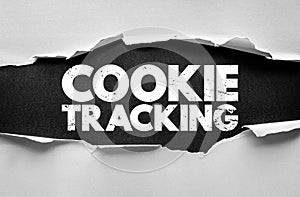 COOKIE TRACKING bold phrase exposed through torn background. Symbolic of website tracking, analytics, data collection, privacy