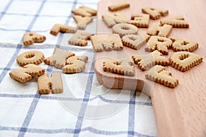 Cookies ABC on wooden plate