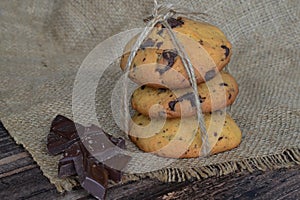 cookies baked by oneself lie on burlap next to chocolate