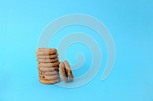 Cookies on blue background. oatmeal cookie with pieces chocolate