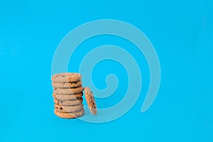 Cookies on blue background. oatmeal cookie with pieces chocolate