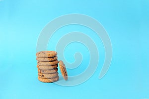 Cookies on blue background. oatmeal cookie with pieces of chocolate