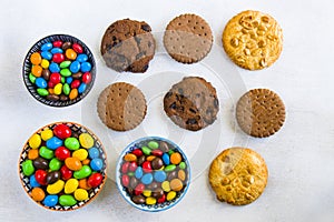 Cookies and chocolate candy balls on a white background