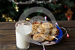 Cookies, defocussed glass of milk and lights