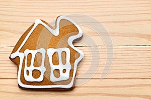 Cookies in the form of a house on wooden background