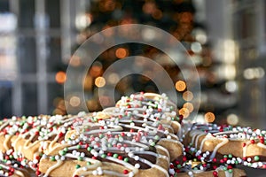 Cookies in front oaf a blurred Christmas tree