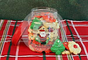 Cookies jar filled with Christmas Cookies and Happy Holidays on front