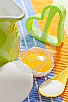 Cookies making: eggs, jug, milk, salt and form