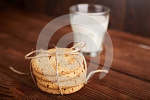 Cookies and milk. Chocolate chip cookies and a glass of milk. Vintage look. Tasty cookies and glass of milk