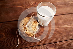 Cookies and milk. Chocolate chip cookies and a glass of milk. Vintage look. Tasty cookies and glass of milk