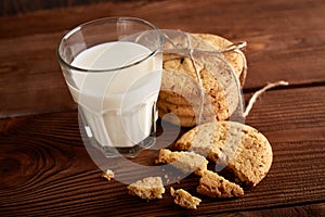 Cookies and milk. Chocolate chip cookies and a glass of milk. Vintage look. Tasty cookies and glass of milk