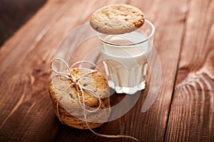 Cookies and milk. Chocolate chip cookies and a glass of milk. Vintage look. Tasty cookies and glass of milk