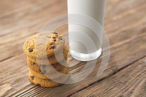 Cookies and milk on wooden table