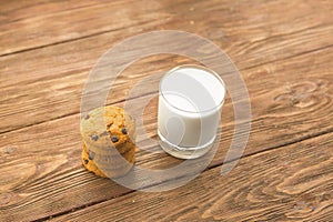 Cookies and milk on wooden table