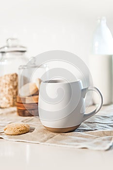 cookies and morning drink, coffee, milk or tea in light natural envoronment, kinfolk style breakfast