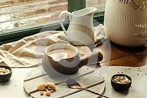 cookies and morning drink, coffee, milk or tea in light natural envoronment, kinfolk style breakfast