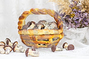 Cookies mushrooms glazed in white and brown chocolate in wicker basket of dough. Dessert. Beautiful