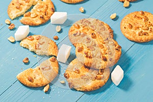 cookies with nuts and lump sugar/cookies with nuts and lump sugar on blue wooden table freshly baked