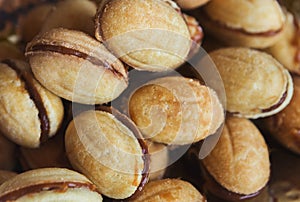Cookies in shape of nut with condensed milk, closeup
