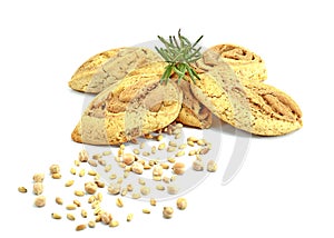 Cookies of soybeans and grains of wheal with twig of rosemary on white background