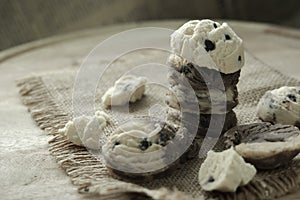cookies stack on hemp sack above wooden table