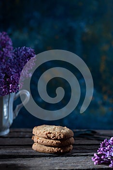 cookies still life in a rustic style on an abstract background, with spring flowers